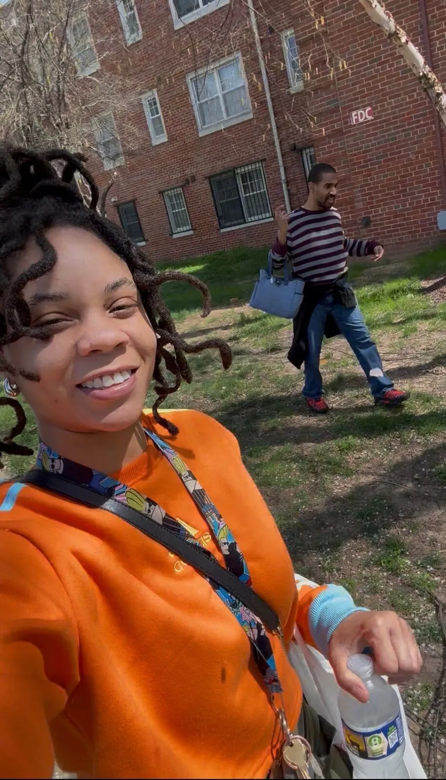 Kha'Deisha Warren smiles in a selfie on a sunny day in the neighborhood.