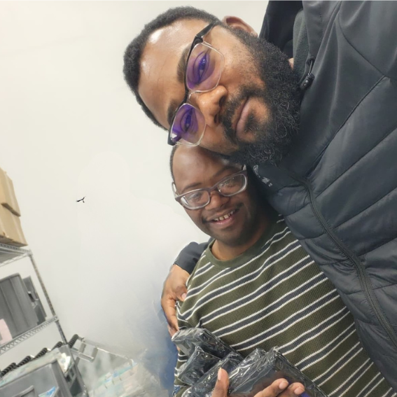 Mercyland Direct Support Professional Yannick with Tremain Jones.