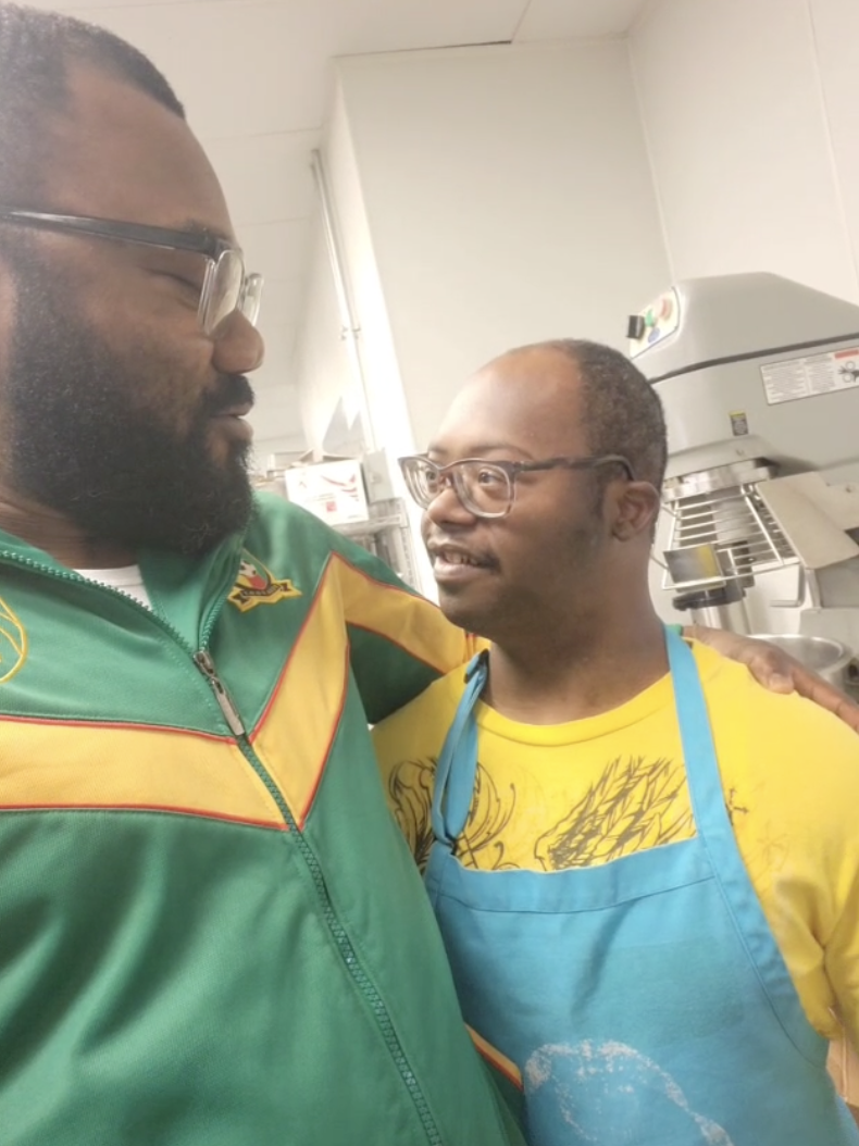 Yannick and Tremain Jones during a volunteering shift.